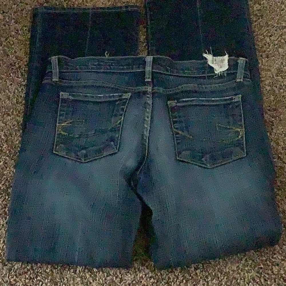 Women’s Dark Blue Bootcut Jeans with Subtle Distressing